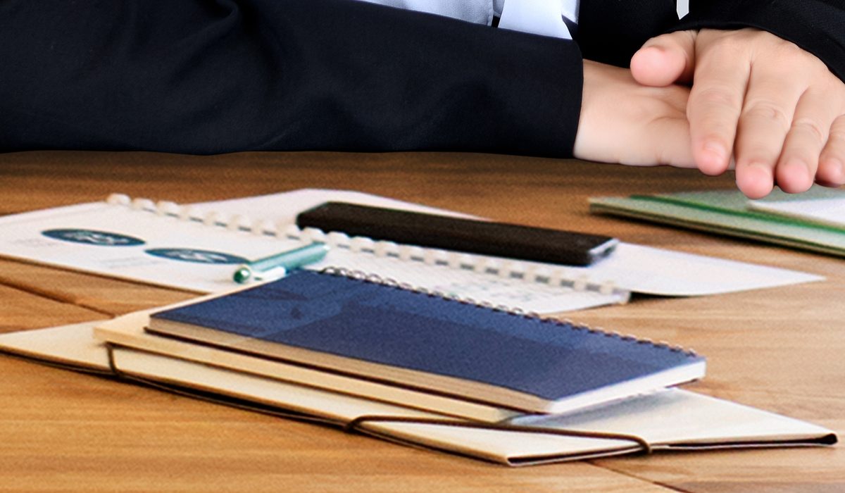 Notebooks and clinical records on the consultation desk